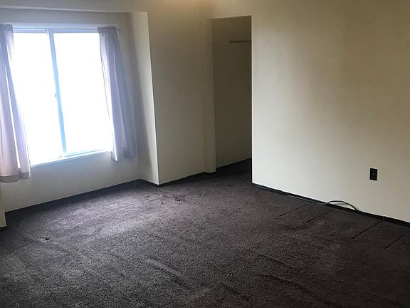 Master bedroom with view of the city. Dimensions are 17 feet x 14 foot 3 inches.