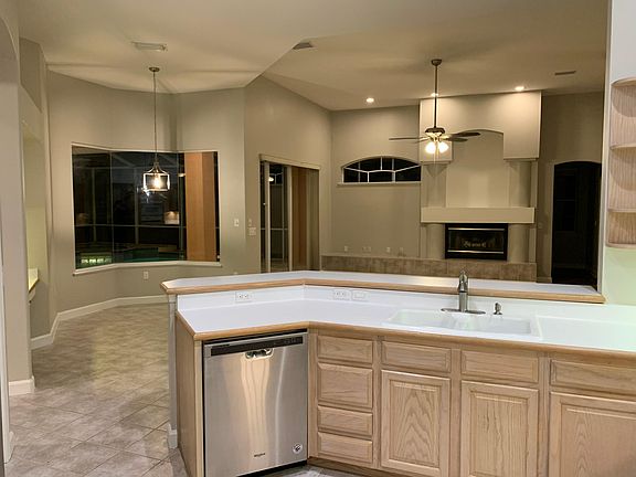 Gourmet kitchen overlooking family room and out to lanai and breakfast area