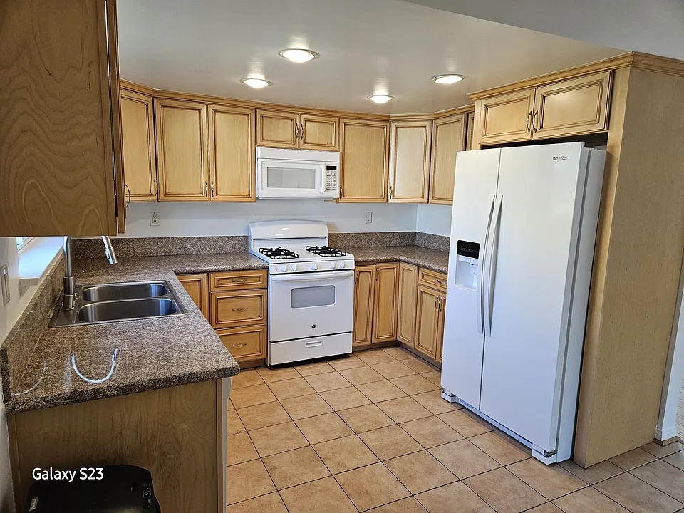 Kitchen: new fridge with icemaker and indoor water. Oven/range, microwave, dishwasher, garbage disposal.