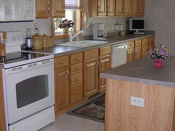 Enormous eat in kitchen with TONS of cabinet and counter space
