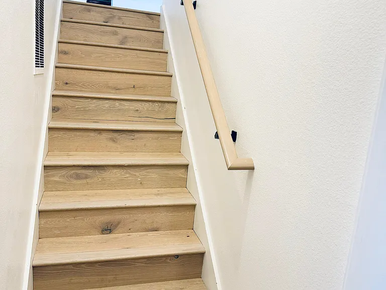 stairs from living room to fully furnished basement
