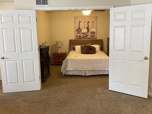 Unique double door 11 X 12 bedroom.