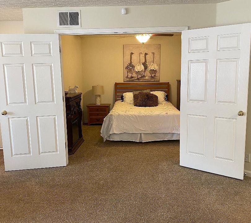 Unique double door 11 X 12 bedroom.