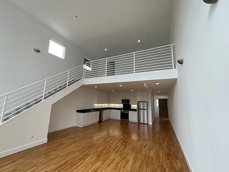Stunning view of the newly updated kitchen / living room offering a neutral palette.