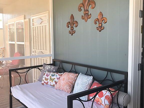 screened porch with daybed