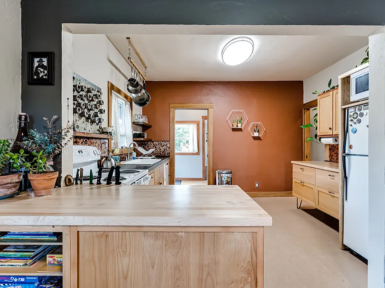 Large kitchen with bountiful cabinetry.