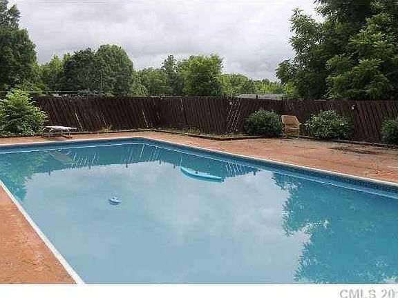 In ground pool : Large lot behind the pool for privacy included in the home.
