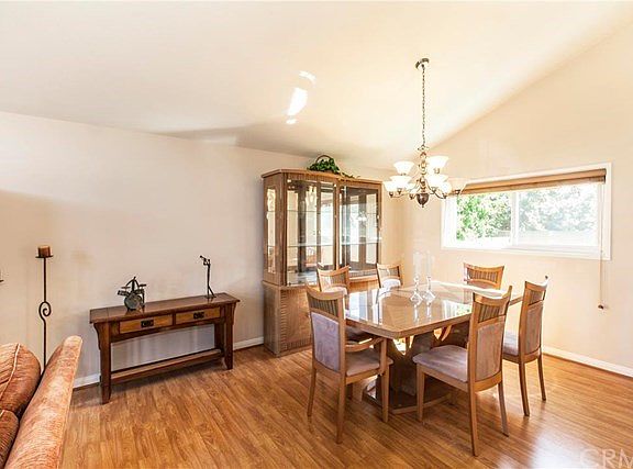 Living room is open to the formal dining room with even more light.