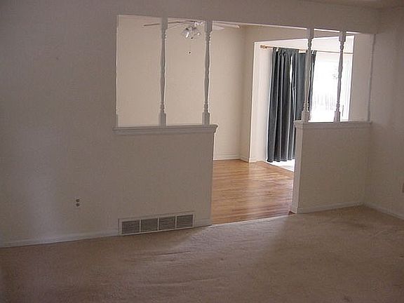Front door, through living room, into kitchen