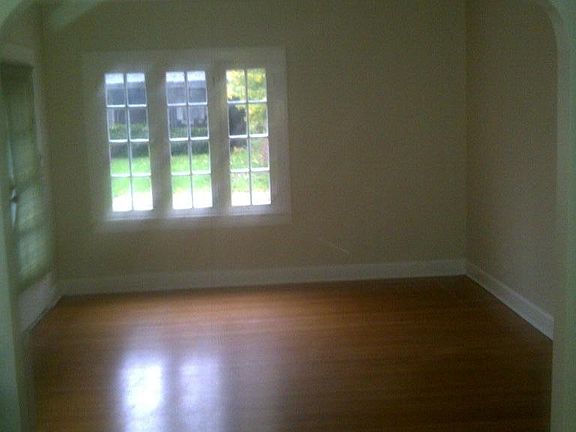Living room and dining room separated by arch