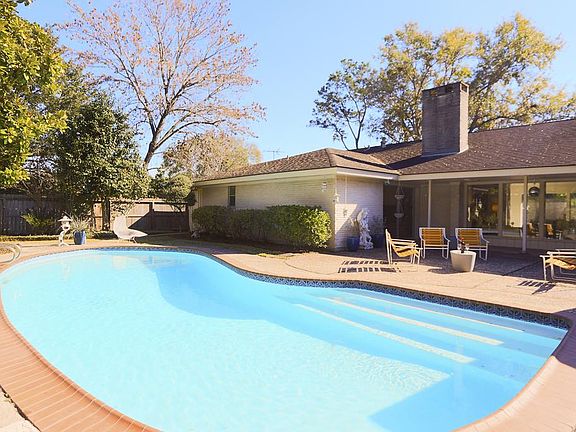 Pool-size entertaining is a pleasure around your pool with abundant outside areas and lush landscaping.