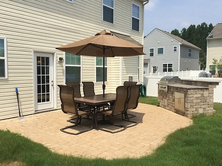 Back patio with built-in grill. Firepit (not shown)