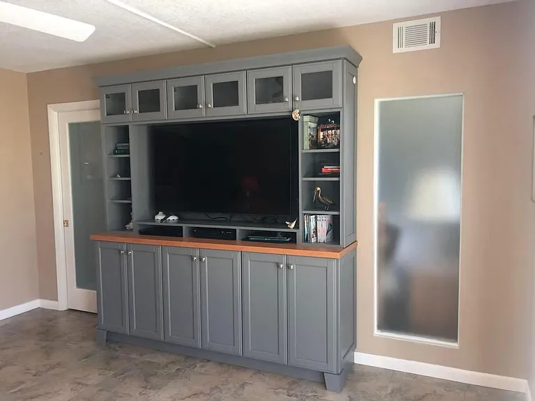 Custom Entertainment Unit; beaded frosted glass on pocket door and primary bedroom