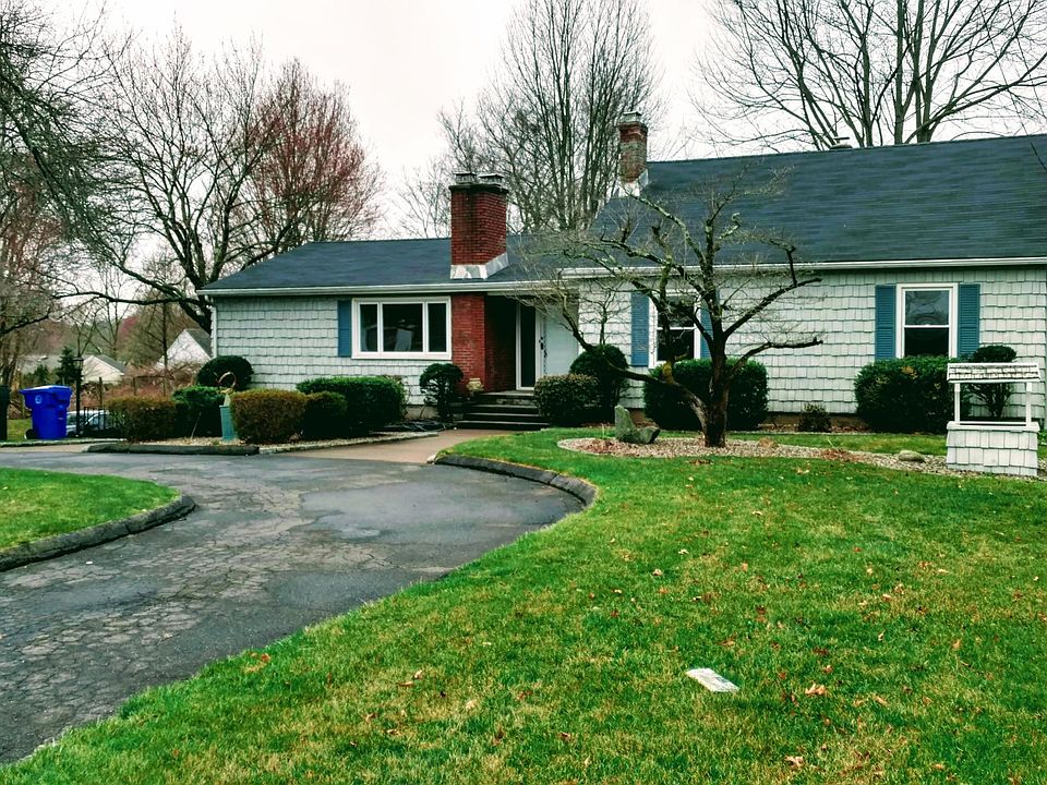 Mature landscaping give this house great curb appeal. Front yard features a quaint well.