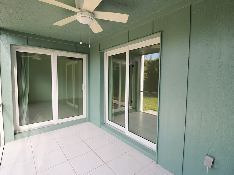 Lanai with impact glass sliders.