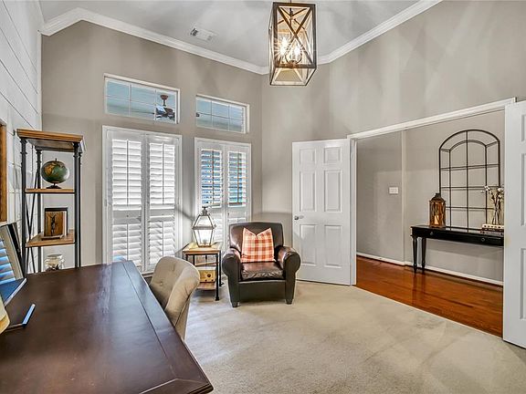 The room just inside the entry is used as a study but can also double as a guest room.