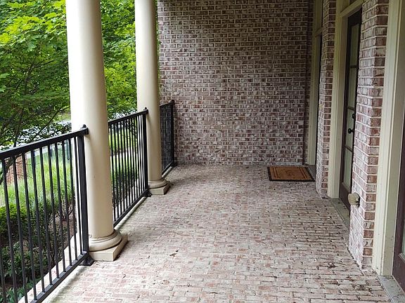 Large porch accommodates outside seating.