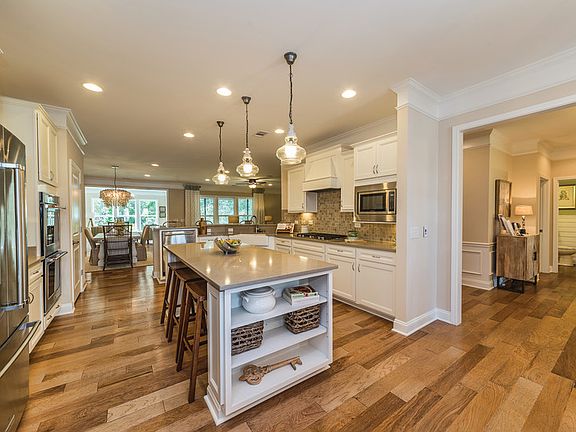 Large Gourmet Kitchen with Center Island that makes preparing your favorite meals a breeze. - Model