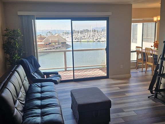 Livingroom out to balcony overlooking marina
