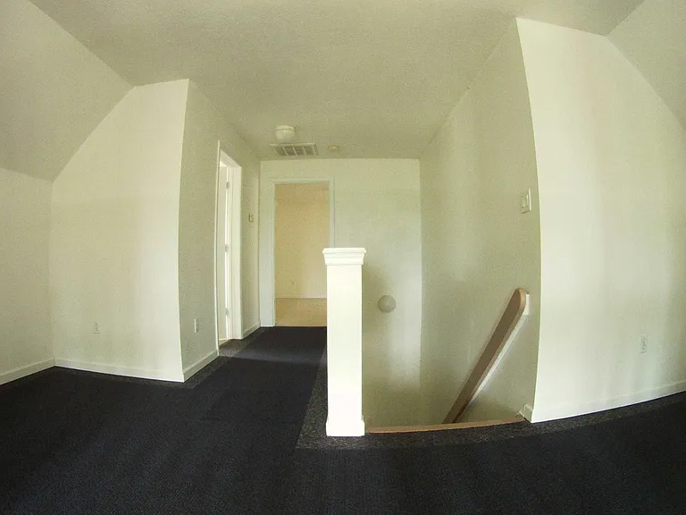 Top landing on second level and entry to master suite and bathroom
