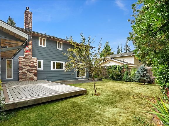 Fully fenced level yard, ornamental shrubs, fruit trees.