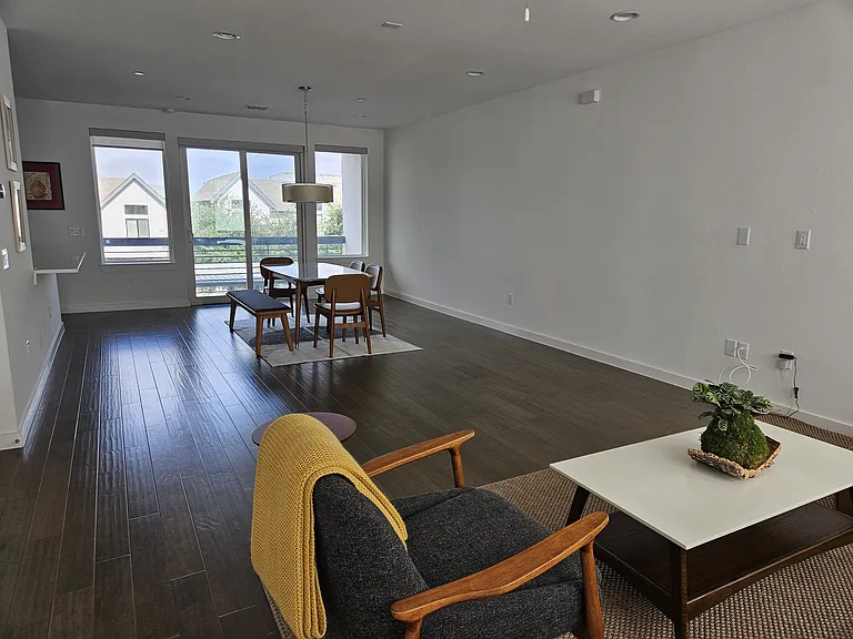 Second floor living room looking into dining area