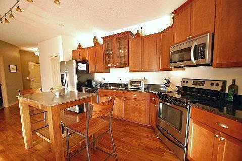 Kitchen w/ Stainless Steel Appliances & Granite Countertops