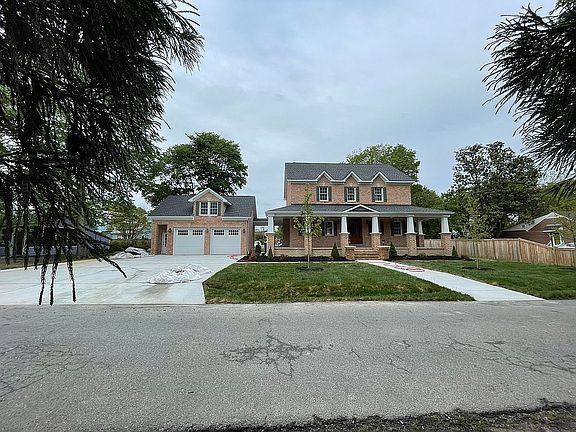 Sod lawn , concrete driveway