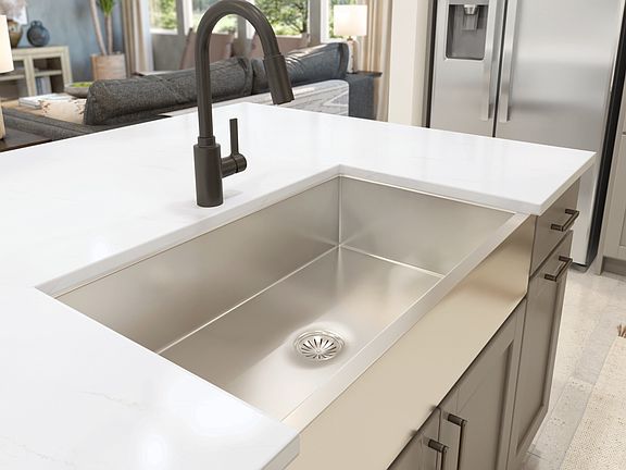 Stainless steel undermount apron-front sink with matte black faucet