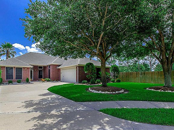 WELCOME HOME TO THIS PRIVATE WOODED SANCTUARY WITH EXCELLENT CURB APPEAL ~