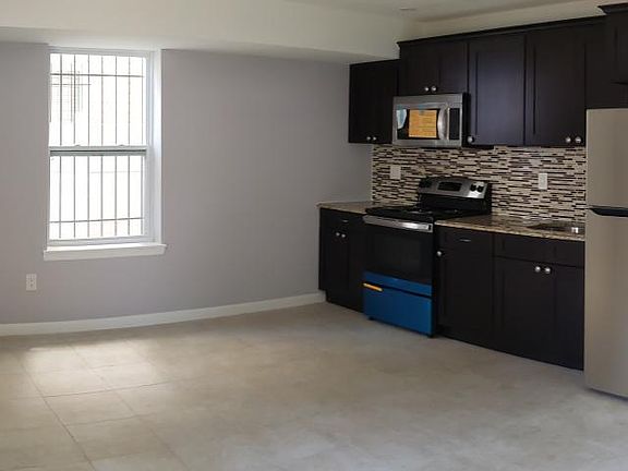 Wall Kitchen + Living Room Space + Entry Hallway. All New Appliances