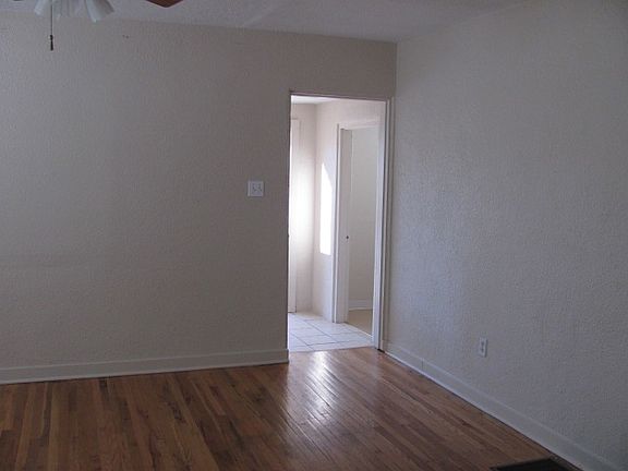 Hardwood floors in living room and one bedroom