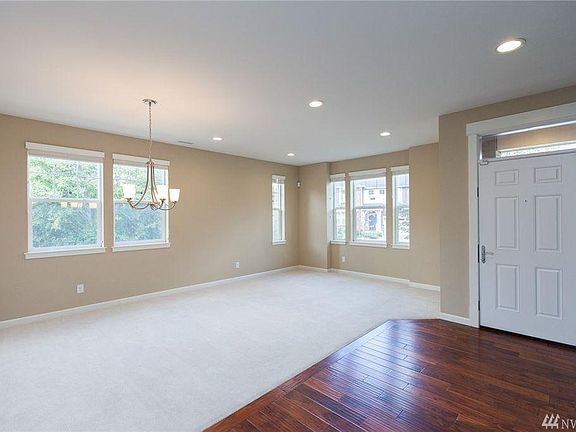 Entryway (front door) with formal living room and dining room