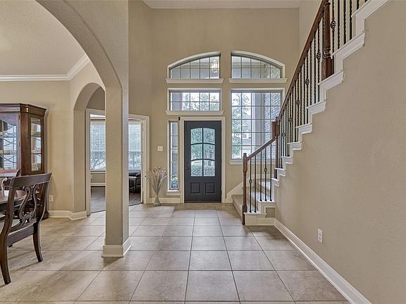 The front entryway is very bright and spacious! The oversized windows allow lots of natural light into the home.