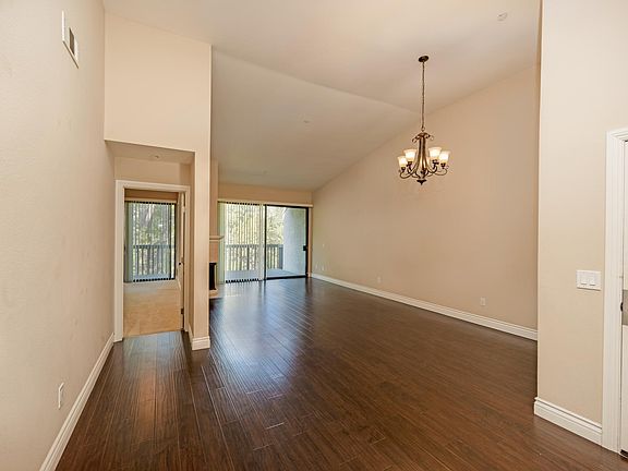 living room has high vaulted ceiling