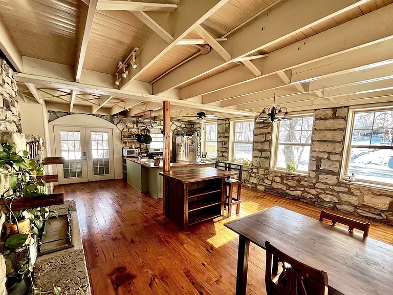 Large open kitchen and dining area with stunning exposed stone walls_perfect for large group meals.