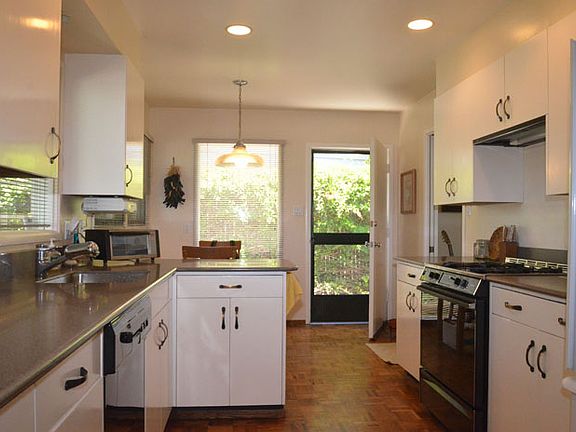 Kitchen opens to BBQ Area