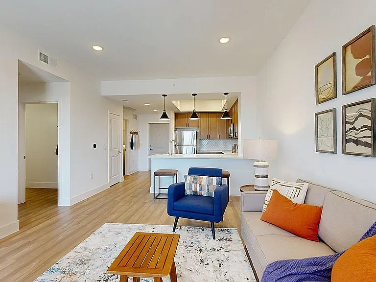 Experience modern comfort in this beautifully designed living space featuring an open kitchen layout.