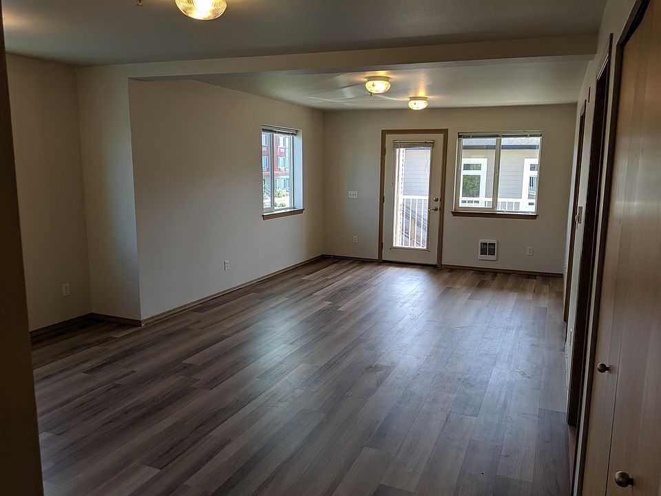 Spacious living room & dining room with patio