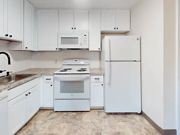Designer cabinets with new hardware, fully applianced with built in microwaves