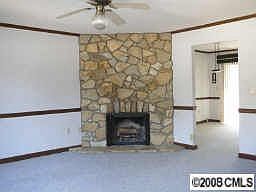 Stone wood burning fireplace in nice size family room. 