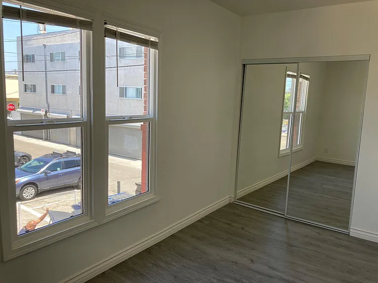 Bright upper corner unit with mirror closest doors