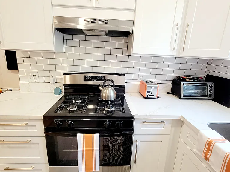 Full kitchen with gas stove, toaster, blender, coffee maker, pots/pans, etc