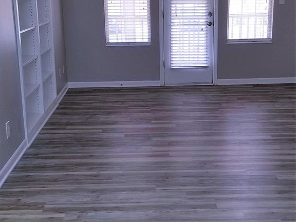 Living room looking onto screened in deck