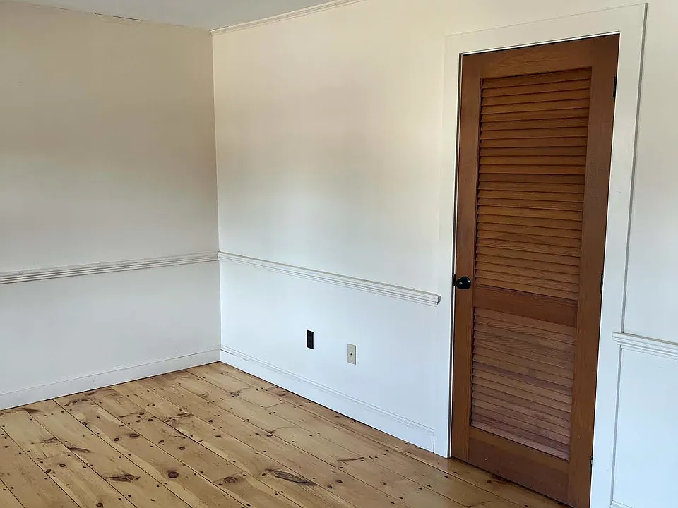 Living room with closet.