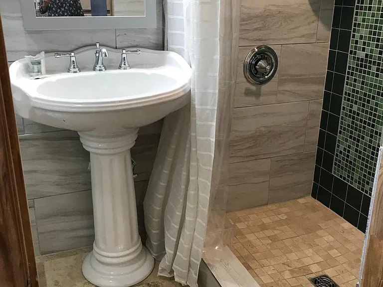 stylish tiled shower and bath