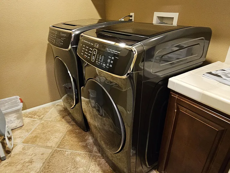 High efficiency Washer and Dryer in the laundry.