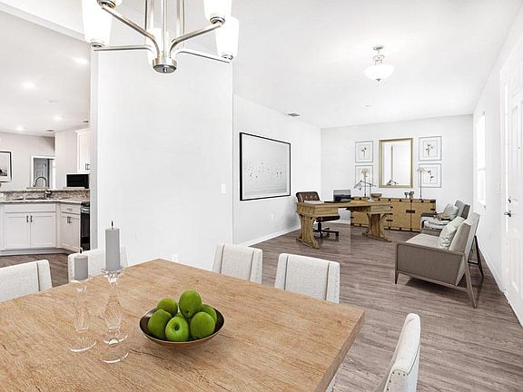 A versatile den and dining room provide flexible space to use as you choose - New home for sale in