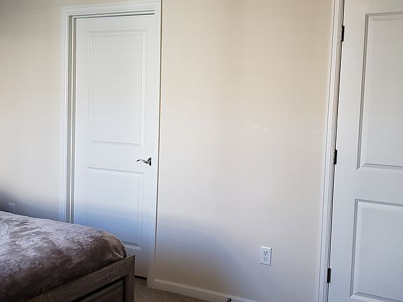 Linen closet and attached bathroom in master retreat