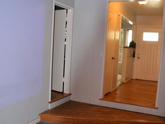 Center large space floor to ceiling double windows looking out on patio & backyard.